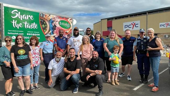 GWS Giants volunteers help deliver food to flood victims in Lismore. Supplied