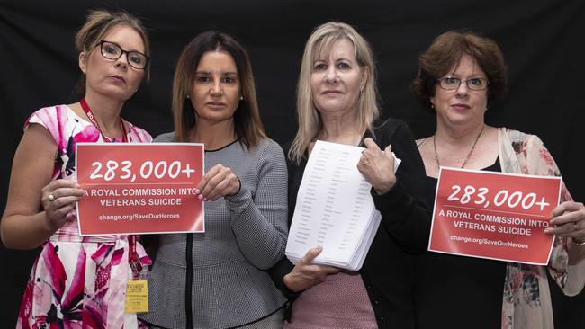 Nikki Jamieson, Senator Jacqui Lambie, Julie-Ann Finney and Colleen Pillen with the petition calling for a royal commission. Picture: Gary Ramage