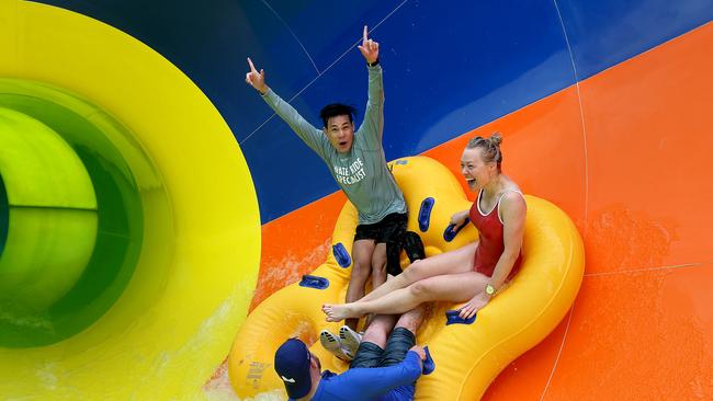 Canadian waterslide testers Tri Nguyen (grey) and Jesse Hastie (blue) with Bree Salmon (Adventure Park) on the new slide at Adventure Park. picture: Glenn Ferguson