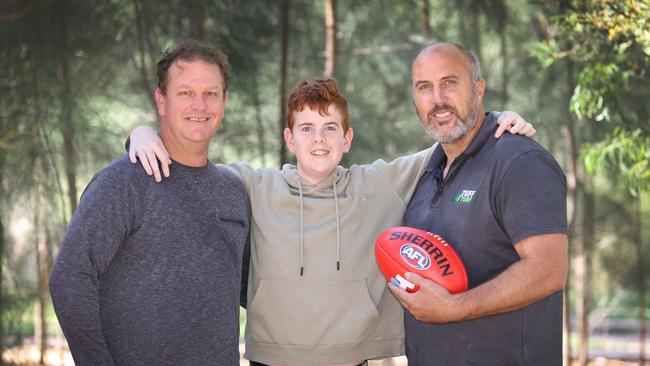 Bone marrow transplant recipient Blake Dridan with his dad Luke and former AFL St Kilda great Fraser Gehrig. Picture: David Caird