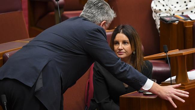 Mathias Cormann and Senator Lambie have a chat. Picture: AAP