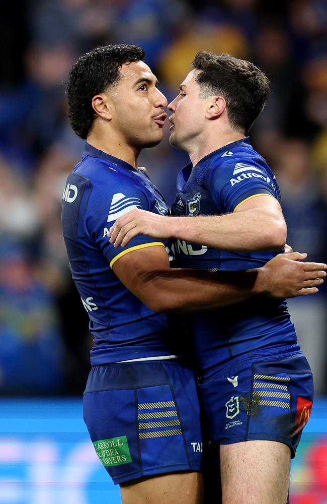 SYDNEY, AUSTRALIA – JUNE 15: Mitchell Moses of the Eels celebrates with teammate Will Penisini after scoring a try during the round 15 NRL match between Parramatta Eels and Sydney Roosters at CommBank Stadium, on June 15, 2024, in Sydney, Australia. (Photo by Brendon Thorne/Getty Images)