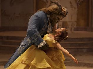 This image released by Disney shows Dan Stevens as The Beast, left, and Emma Watson as Belle in a live-action adaptation of the animated classic "Beauty and the Beast." (Disney via AP)