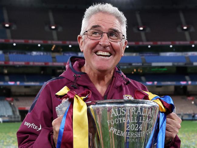 MELBOURNE , AUSTRALIA. SEPTEMBER 28, 2024. AFL Grand Final between the Sydney Swans and the Brisbane Lions at the MCG. Chris Fagan coach of the Brisbane Lions on the empty MCG with the cup. Picture: Mark Stewart