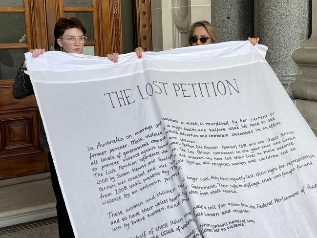 The 30m long petition unfurled on Wednesday night. Picture: Supplied