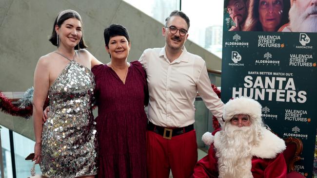 Natalie Rose, Donna Mildren and Richard Jamze at the premiere of Santa Hunters at the Palace Barracks Cinema in Brisbane. Picture: Yuri Nezovic