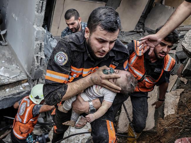 Six-month-old Palestinian baby Sama Alwadia is rescued under rubble after an Israeli airstrike in the Gaza Strip. Picture: Ali Jadallah/Anadolu Agency via Getty Images