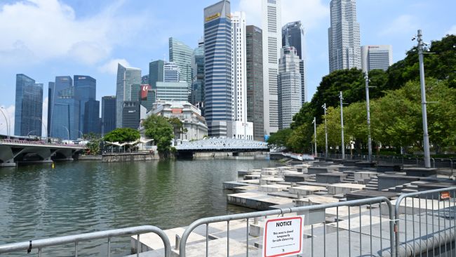 A section of a public area is temporarily closed as preventive measure against Covid-19 coronavirus at the the financial business district in Singapore on June 25, 2021. Photo by ROSLAN RAHMAN/AFP via Getty Images