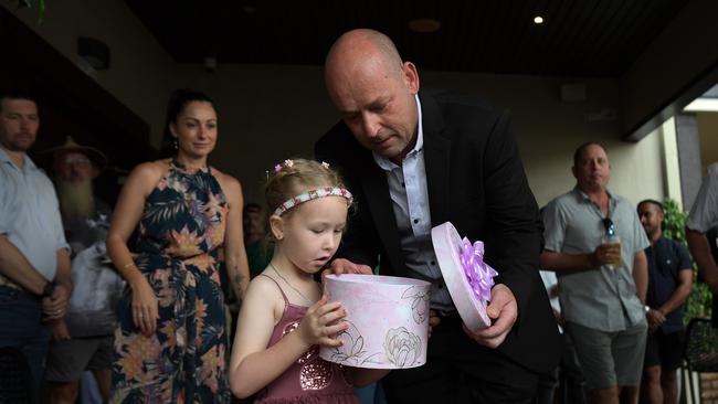 Brooklyn Fairfield and Mick Fairfield release butterflies at the memorial of Sheena Fairfield in Leanyer. Picture: (A)manda Parkinson