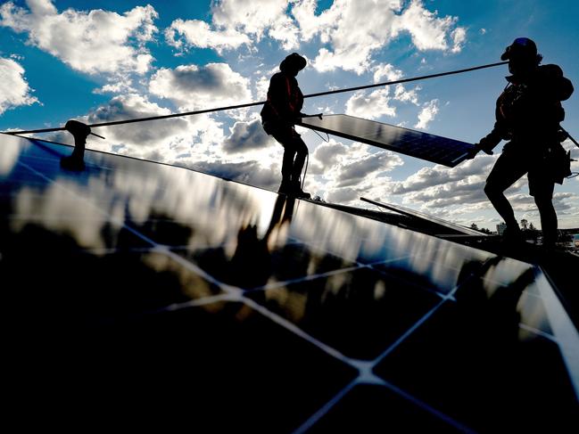 Bloomberg Best of the Year 2021: Solarpro employees install LG Electronics Inc. NeON R 370W solar panels onto the rooftop of a residential property in Sydney, Australia, on Monday, May 17, 2021. Photographer: Brendon Thorne/Bloomberg via Getty Images