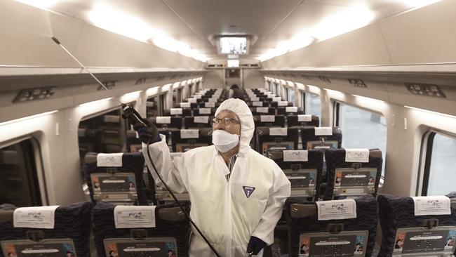 Aircraft being sprayed as fears of an outbreak of coronavirus grow. Picture: AP