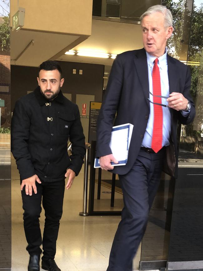 Marc Yaacoub (left) leaves Parramatta Local Court with his lawyer after his most recent sentencing for a driving offence.