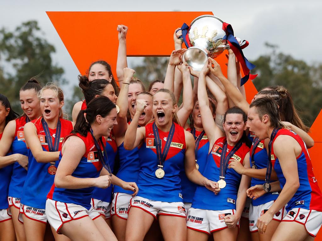 The Demons celebrate after winning Season 7 of the AFLW in 2022. Picture: Dylan Burns/AFL Photos via Getty Images.