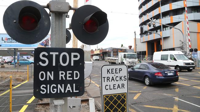 There will no longer be boomgates along the major Bell St arterial through Melbourne’s north once the level crossing removal is completed. Picture: Hamish Blair