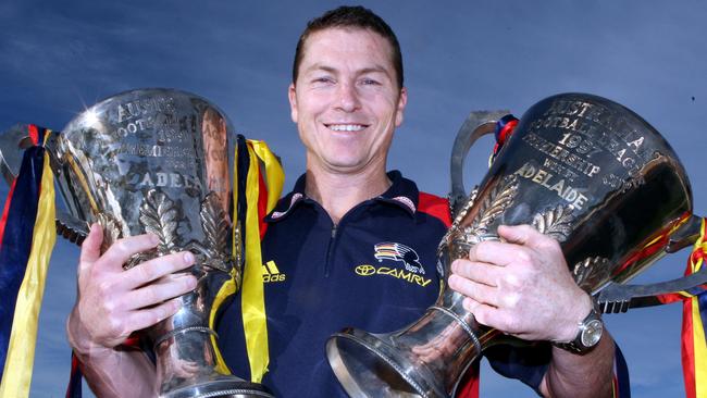 Dual Adelaide premiership captain Mark Bickley with the 1997 and 1998 premiership cups.