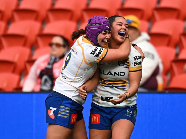 Kennedy and Rueben Cherrington celebrate after a try against the Broncos. Picture: Albert Perez/Getty Images