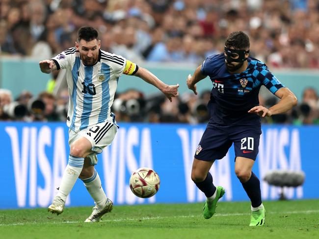 LUSAIL CITY, QATAR - DECEMBER 13: Lionel Messi of Argentina battles for possession with Josko Gvardiol of Croatia during the FIFA World Cup Qatar 2022 semi final match between Argentina and Croatia at Lusail Stadium on December 13, 2022 in Lusail City, Qatar. (Photo by Lars Baron/Getty Images)