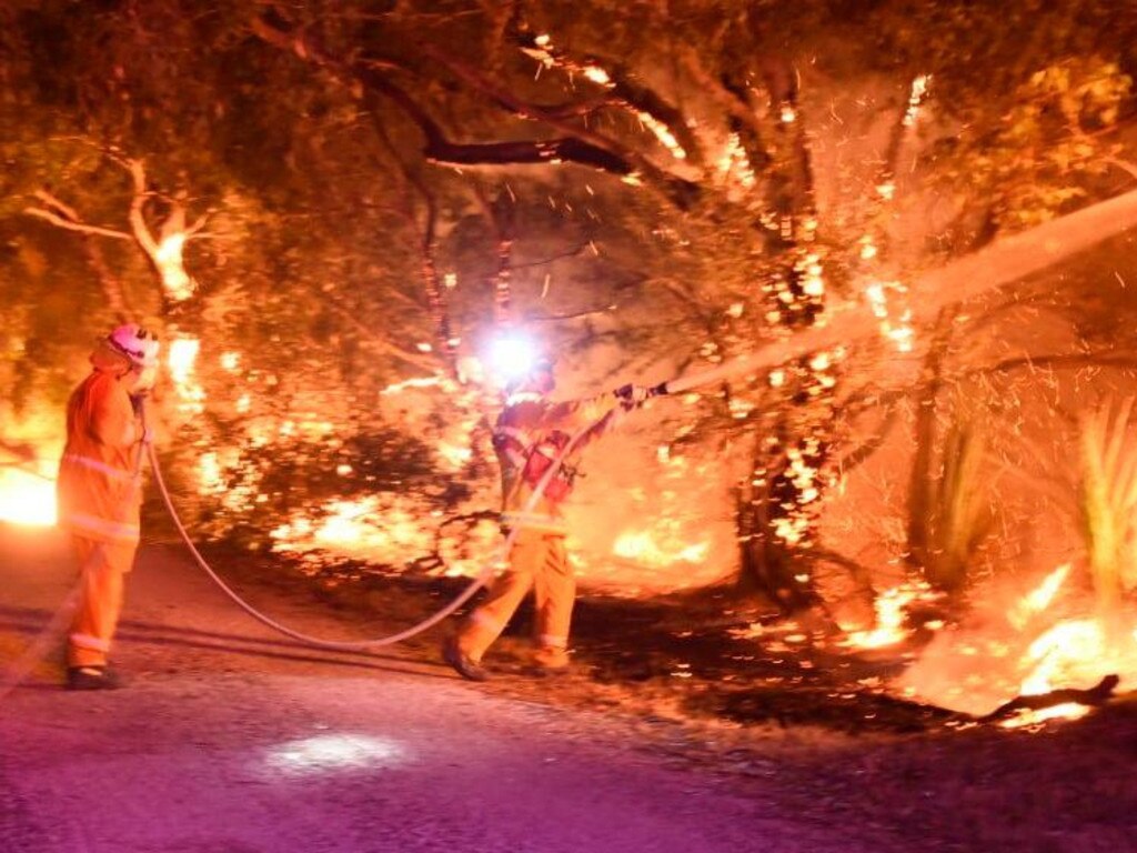 CFS firefighters at Tarrara Lane, Bradbury, successfully prevented the fire from crossing the roadway. PIcture: Brittany Norris/CFS