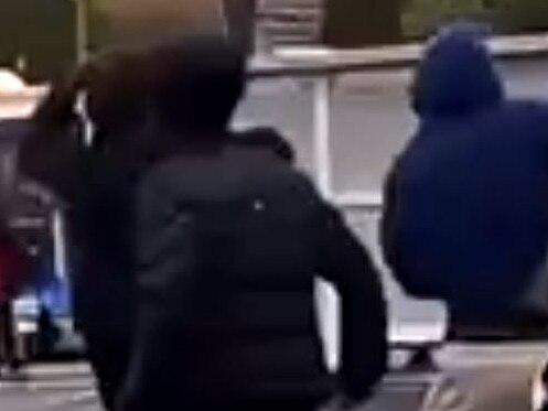 One of the boys in the video appears to be brandishing a machete. Picture: TikTok