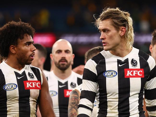 MELBOURNE, AUSTRALIA - JULY 20: The Magpies look dejected following the round 19 AFL match between Hawthorn Hawks and Collingwood Magpies at Melbourne Cricket Ground on July 20, 2024 in Melbourne, Australia. (Photo by Graham Denholm/AFL Photos/via Getty Images)