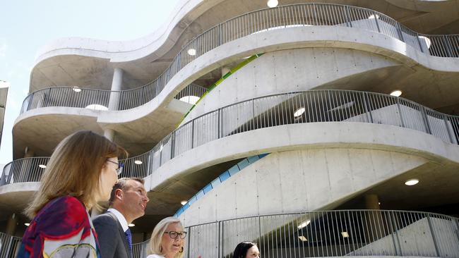 The classroom building resembles a unit block on the outside and Google headquarters on the inside.