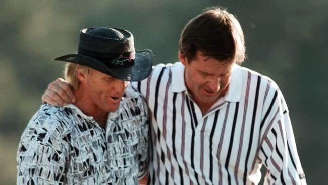 England’s Nick Faldo, right, consoles Australia’s Greg Norman after winning the Masters at Augusta in 1996. Picture: AP