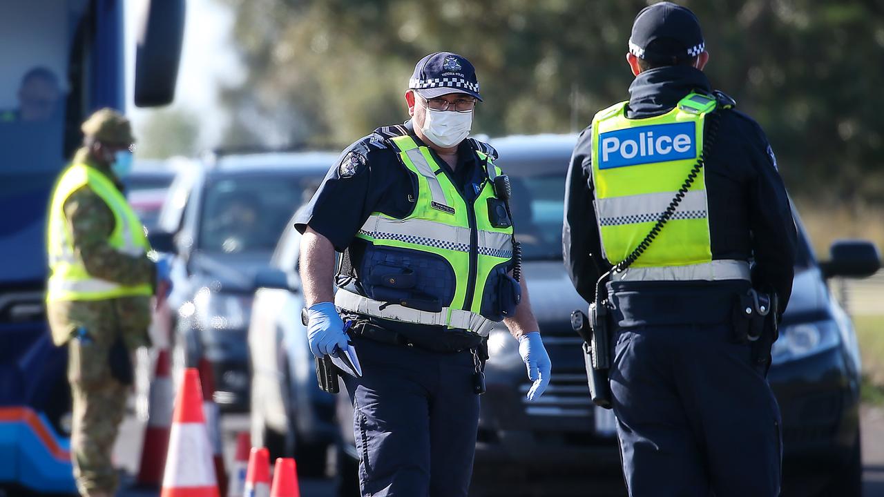 Police and ADF personnel check cars at Little River, near Geelong in early July. Picture: NCA NewsWire / Ian Currie