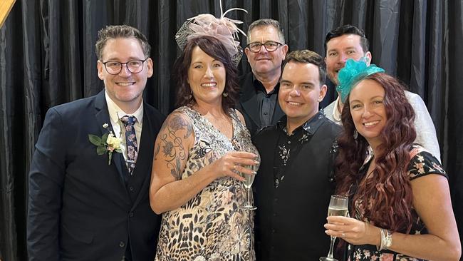 A group having a ball at the Carriers Arms Hotel's Melbourne Cup Day luncheon.