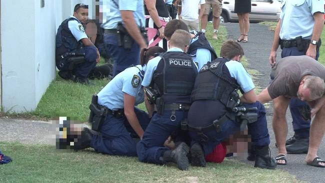 Officers make an arrest at the scene on Ocean Ave at Newport Beach. Picture: TNV