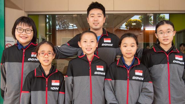 Team Singapore from L-R Ng Soon Chen, Kylie Xie, Megan Tan, Coach Liu Peng, Xu Chen Xi and Clara Tan at the WTT Youth Contender Darwin 2023, Marrara Indoor Stadium, Darwin. Picture: Pema Tamang Pakhrin