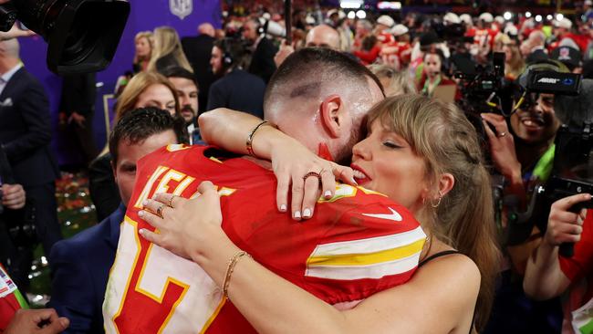 Swift and Kelce celebrated the star’s win with a warm embrace and a kiss in the crowd. (Photo by Ezra Shaw/Getty Images)