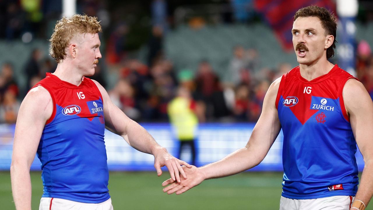 Clayton Oliver (left) is working back to full fitness while playing as his hand heals following a dislocated finger at training a fortnight ago. Picture: Michael Willson / Getty Images