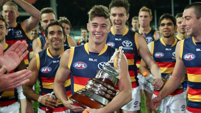 Riley Knight leads Adelaide off the field after winning the emotionally-charged 2015 Showdown, played in honour of the Crows’ late coach Phil Walsh. Picture: Calum Robertson