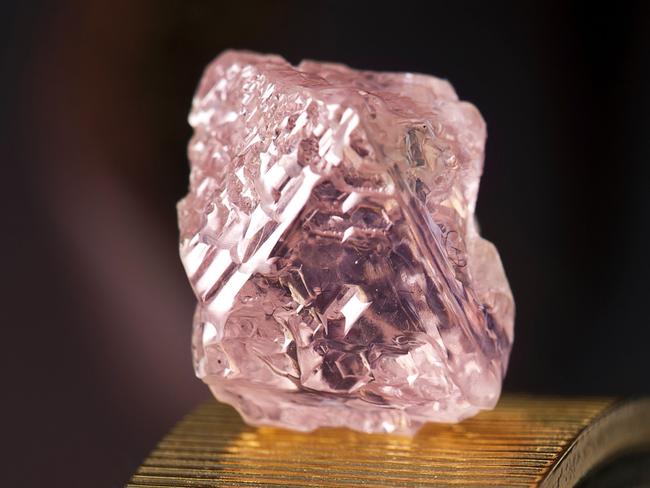 An undated handout photo released by mining giant Rio Tinto on February 22, 2012 shows a 12.76 carat pink diamond -- the largest of the rare and precious stones ever found in Australia. Named the Argyle Pink Jubilee, the rough stone was found at Rio's pink diamond operations in the Kimberley region of western Australia and would take 10 days to cut and polish in Perth.  --- EDITORS NOTE --- RESTRICTED TO EDITORIAL USE MANDATORY CREDIT  NO MARKETING NO ADVERTISING CAMPAIGNS - DISTRIBUTED AS A SERVICE TO CLIENTS   AFP PHOTO / HO / RIO TINTO