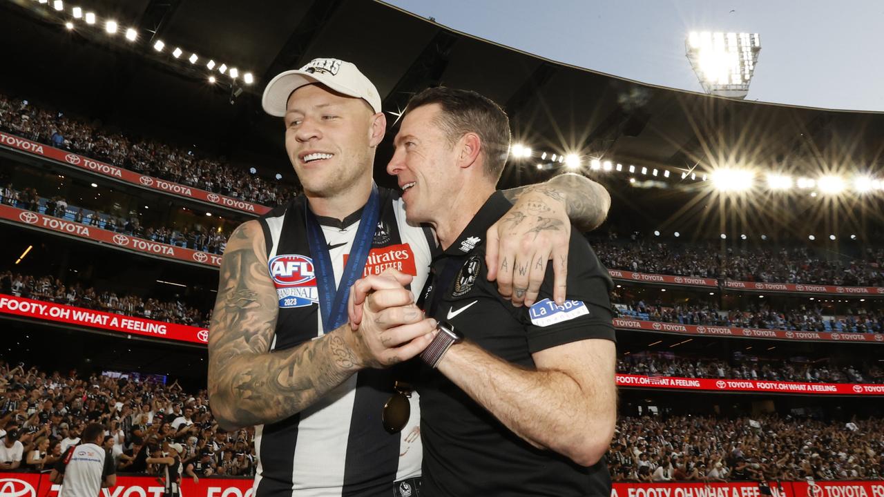 Jordan De Goey walks off the MCG with Craig McRae. Picture: Darrian Traynor/AFL Photos/via Getty Images