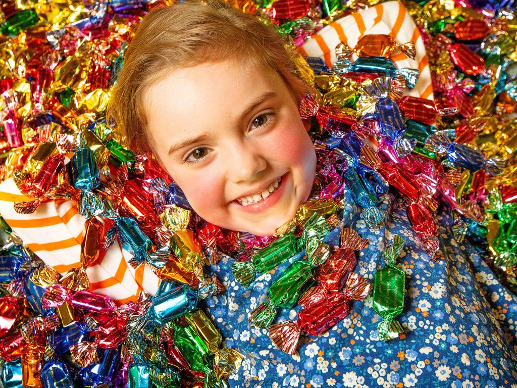 Darrell Lea is set to open a 'chocolate centre of excellence' at the former site of Heritage Fine chocolates, Rowvillle. Molly Bane, 5, pictured with vats of chocolate, is happy with the situation. Picture: Mark Stewart