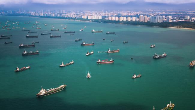 Container ships waiting off the coast from Singapore.