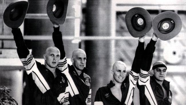 30 Jul 1986 /Edinburgh, Scotland — With their heads shaven, the four members of Aust's " mean machine " L/R Greg Fasalla, Mathew Renshaw, Mark Stockwell, Neil Brooks with their gold medals after winning final of the men's 4 x 100m freestyle relay pic AAP sport o/seas britain swimming headshot