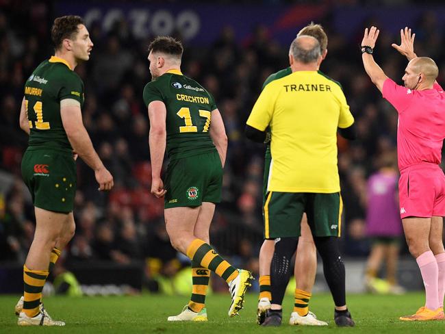 Australia's Angus Crichton (2L) is sent to the sin bin for 10 minutes during the Rugby League World Cup Men's final between Australia and Samoa at Old Trafford stadium, in Manchester, on November 19, 2022. (Photo by Oli SCARFF / AFP)