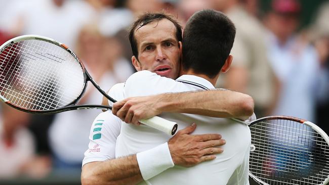Radek Stepanek hugs Novak Djokovic after their Wimbledon meeting in 2014.