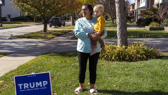 Rebeca Pietrzak and her grandson Landon next to her Trump lawn sign. Picture: Valaurian Waller