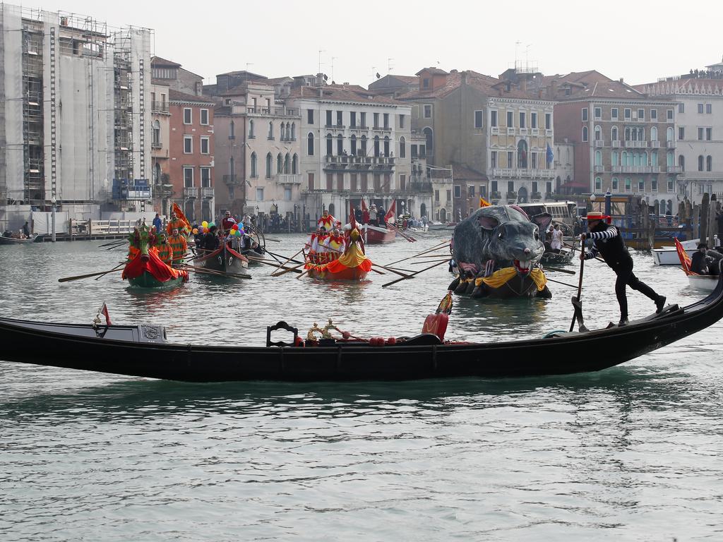 Boats sail during the water parade as part of the Venice Carnival on Sunday. Picture: AP/Antonio Calanni