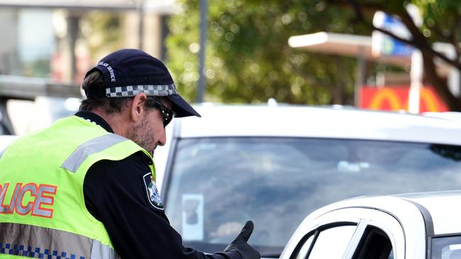 Police check cars at the Queensland border with NSW at Griffith Street at Coolangatta after the border closed the NSW. Picture: NCA NewsWire / Steve Holland