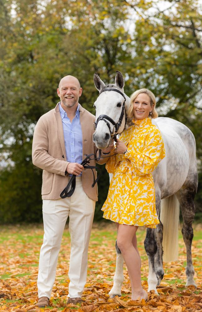 Zara and Mike Tindall with "Happenstance" at her farm on November 23, 2021 in Gloucestershire, England. Picture: Hollie Adams Styling: Kimberly Gardner and Annie Miall (Zara), and Daniel Johnston (Mike), styling sourced via Pacific Fair, major partner of Magic Millions. Zara wears: Rebecca Vallance, jewellery: Calleija. Hair &amp; Makeup: Alisia Ristevski