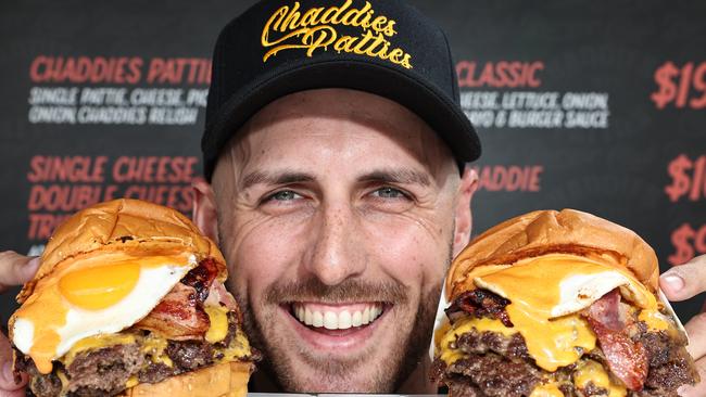 Owner Taran Lee, from Runaway Bay restaurant Chaddies Patties, with some of the Burgers that won the best burger on the Gold Coast. Picture Glenn hampson