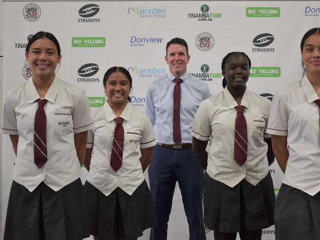 Some of the Marsden SHS Titans Cup schoolgirl players, alongside executive principal Andrew Peach.