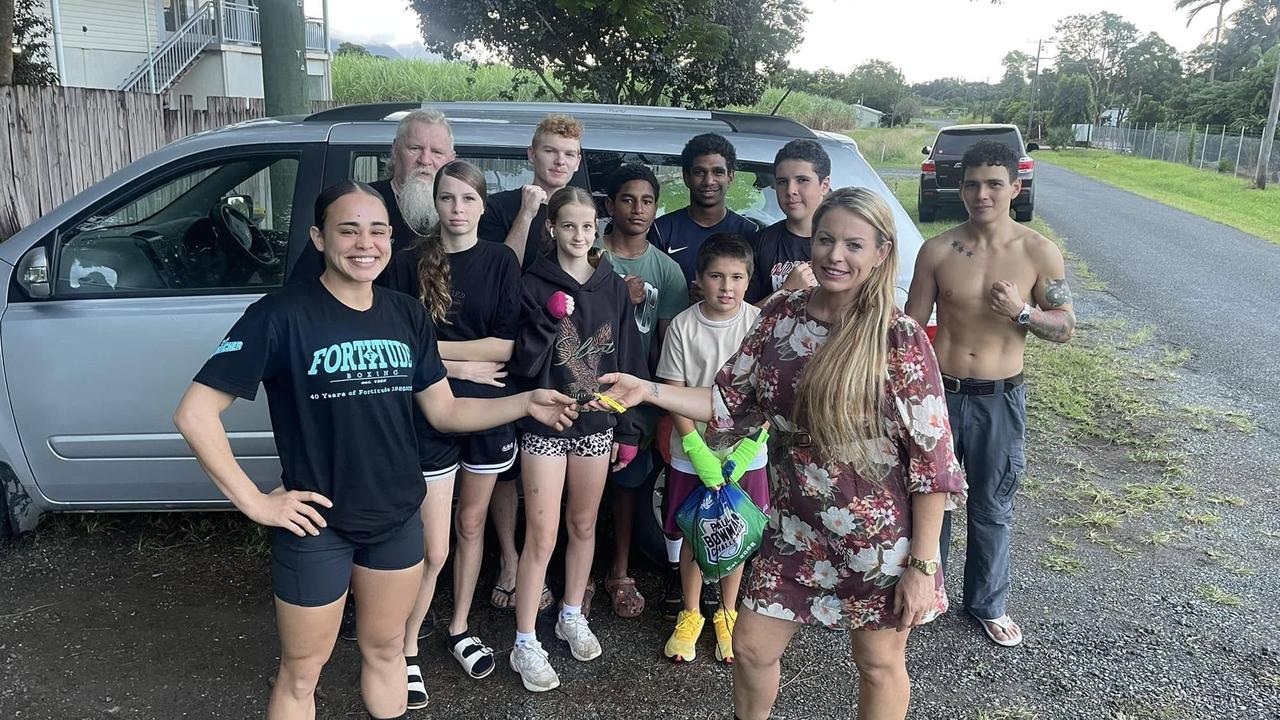 Edmonton mother and equine therapist Sophia Senior (right) hands the keys of her eight-seater van over to Do It Boxing athlete Leah Reuben (left), supported by Zap De Jong and the Do It Boxing crew. Picture: Zap De Jong