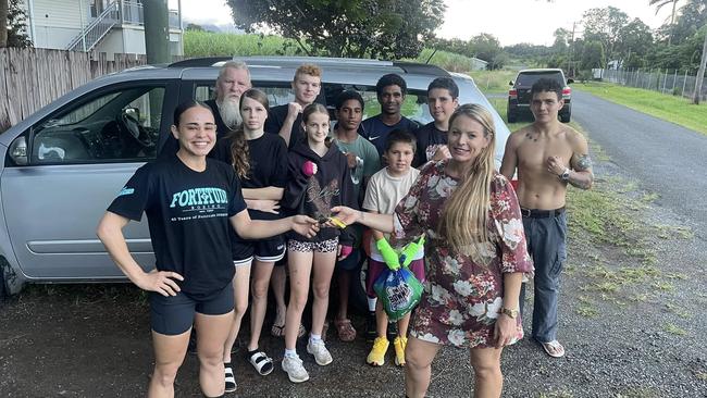 Edmonton mother and equine therapist Sophia Senior (right) hands the keys of her eight-seater van over to Do It Boxing athlete Leah Reuben (left), supported by Zap De Jong and the Do It Boxing crew. Picture: Zap De Jong