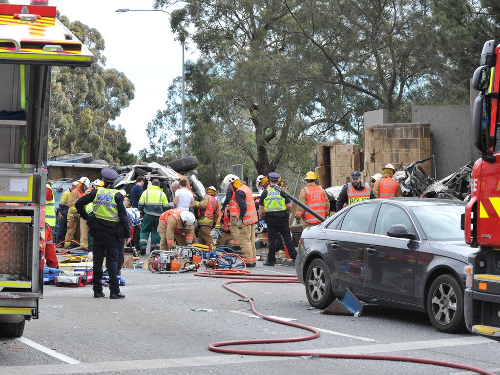 Emergency service workers at the crash on the corner of Glen Osmond and Cross roads. Picture: Roger Wyman