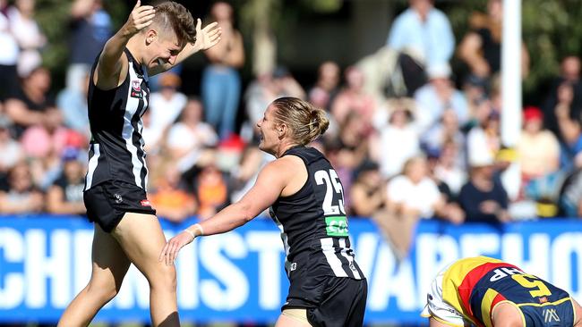 Emma Grant (left) and Meg Hutchins celebrate Collingwood’s win over Adelaide. Picture: AAP Images